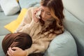 Depressed female with handkerchief seated in bed