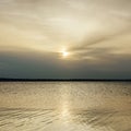 Low sun in clouds over river Royalty Free Stock Photo