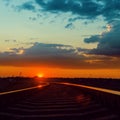 Low sun over railroad in sunset Royalty Free Stock Photo