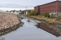 Low tide along New Bedford tidal channel Royalty Free Stock Photo