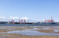 Low Tide in Durban Harbor with Ships Moored in Background