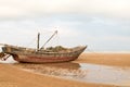 Beached fishing boat at low tide