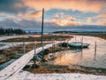Low tide. Fishing pier in the authentic Northern village of Umba. Kola Peninsula, Russia Royalty Free Stock Photo