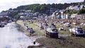 Low tide at the harbour leaving the boats hit and dry