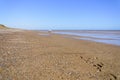 Low tide on Hornsea beach in Yorkshire on a summer day Royalty Free Stock Photo
