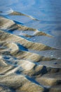 Low tide in the North sea exposed the bottom with sand and water Royalty Free Stock Photo