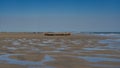 Low tide in the ocean. Traditional Malagasy wooden pirogue boats Royalty Free Stock Photo