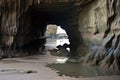 low tide revealing hidden sea cave floor Royalty Free Stock Photo