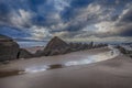 Low tide in rocky beach at dusk Royalty Free Stock Photo