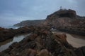 Low tide, textured volcanic rock and the shore