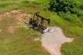 Low view of a working oil pump jack pumping crude in Oklahoma USA Royalty Free Stock Photo