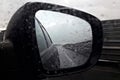 Rear view mirror reflecting road and sky Royalty Free Stock Photo