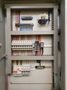 Low voltage switchboard interior with electrical parts Royalty Free Stock Photo