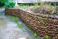A low wall made of stacked stones in the Chinese countryside Royalty Free Stock Photo
