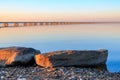 Low water bridge from Sedanka to the De Friz peninsula across the Amur Bay of Primorsky Krai Russia against the background of a Royalty Free Stock Photo