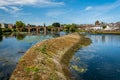 Low water and a dry caul weir during a summer drought on the River Nith Royalty Free Stock Photo