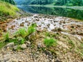 Low water level, empty river inflow. Muddy horrible smell water