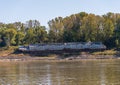 Beached freight barge on side of Mississippi river in low water