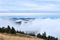 Low white clouds above distant forest hills landscape Royalty Free Stock Photo