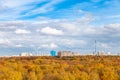 Low white clouds in blue sky over yellow city park Royalty Free Stock Photo