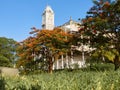 Low wide angle side view to the Clock tower of House of Wonders, Stone Town, Zanzibar. Royalty Free Stock Photo