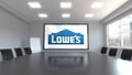 Lowe`s logo on the screen in a meeting room. Editorial 3D rendering`