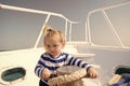 Lower the anchor. Adventure boy sailor travelling sea. Child cute sailor help with ropes yacht bow. Baby boy enjoy