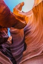 Lower Antelope Canyon`s Wave-curved rock maze with changing light and shadow.