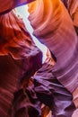 Lower Antelope Canyon`s Wave-curved rock maze with changing light and shadow.