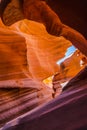 Lower Antelope Canyon`s Wave-curved rock maze with changing light and shadow.