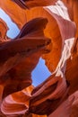 Lower Antelope Canyon`s Wave-curved rock maze with changing light and shadow.