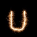 Lower case u letter of alphabet on a black background Royalty Free Stock Photo