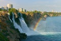 Lower Duden Waterfall in Antalya, Turkey. A beautiful landscape of waterfall, rainbow, sea and city Royalty Free Stock Photo