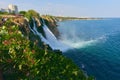 Lower Duden Waterfall in Antalya, Turkey. A beautiful landscape of waterfall, sea and city Royalty Free Stock Photo