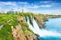 Lower Duden waterfall in Antalya, Turkey. Water falls drop off rocky cliff directly into Mediterranean sea in sunny summer day Royalty Free Stock Photo