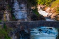 Lower Falls and a walking bridge across the gorge of the Genesee River, Letchworth State Park, New York. Royalty Free Stock Photo