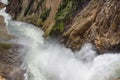 Lower falls Yellowstone river. Raging waters. Spray from waterfall.