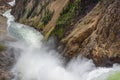 Lower falls Yellowstone river. Raging waters. Spray from waterfall.