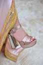 The lower half of the Moroccan bride with a Moroccan caftan and luxury shoes.