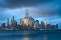 Lower Manhattan illuminated skyscrapers and storm clouds, New York City Royalty Free Stock Photo