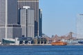 Lower Manhattan, NYC skyscrapers tower over the Staten Island Ferry terminal. In the background is the Brooklyn Bridge Royalty Free Stock Photo