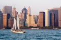 The lower Manhattan skyline in New York with a sailboat Royalty Free Stock Photo