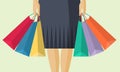 The lower part of the woman with packages after shopping in flat