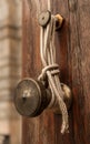 The lower part of a wooden flagpole with a metal attachment for a rope where a flag raises or puts down, shot in Prague Castle.