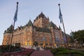 Lower point of view of renowned Chateau Frontenac with UNESCO sculpture and flags