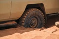 Lower section of a safari vehicle stuck in the sand at Chalbi Desert in Marsabit County, Kenya