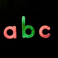 Alphabet ABC in different colors And in black background Royalty Free Stock Photo