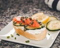 Lox and Cream Cheese with Capers, a Slice Cucumber and a Squeeze