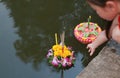 Loy Krathong festival, Asian Child girl floating krathong in pond for forgiveness Goddess Ganges to celebrate festival in Thailand Royalty Free Stock Photo