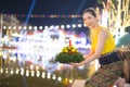 Loy Krathong Traditional Festival, A beautiful Thai woman holds a Krathong ornamental form banana leafs in Loy Krathong